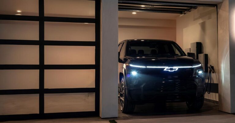 chevy electric truck charging in garage at night d